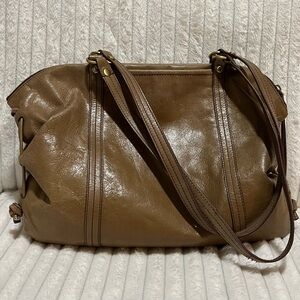 HOBO Flourish leather shoulder bag in the color taupe.